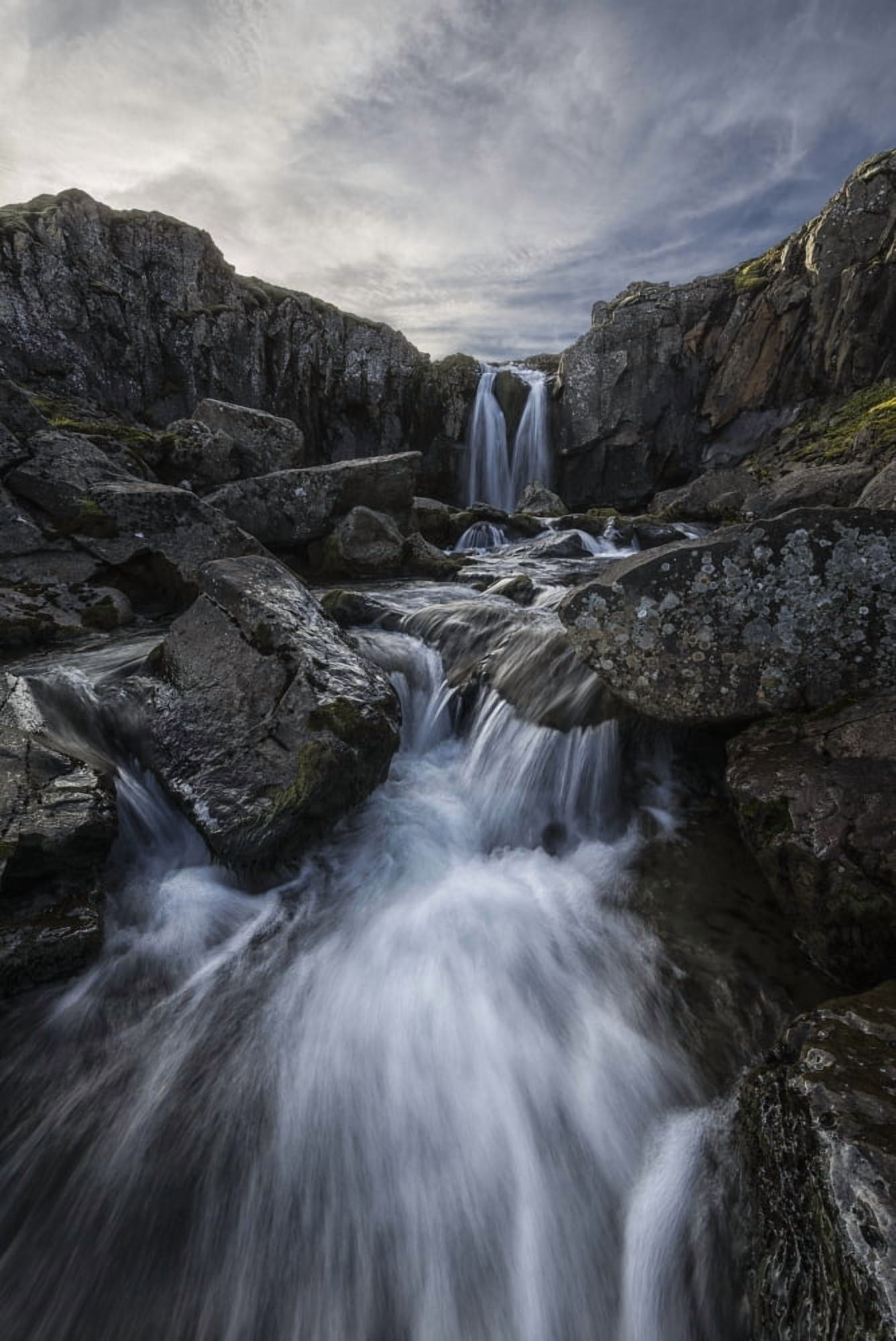 Posterazzi Stream flows over a waterfall along the eastern coast of Iceland Iceland Canvas Art - Robert Postma Design Pics (24 x 36)