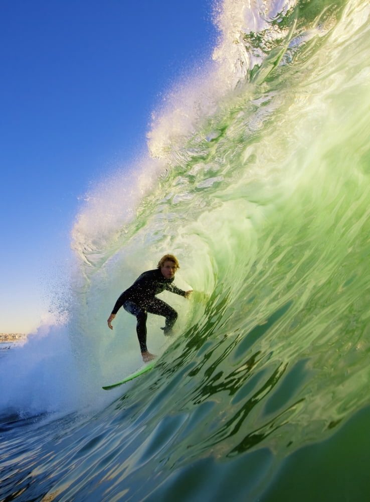 Posterazzi Surfer On Blue Ocean Wave Canvas Art - Design Pics Vibe  Design Pics (22 x 32)