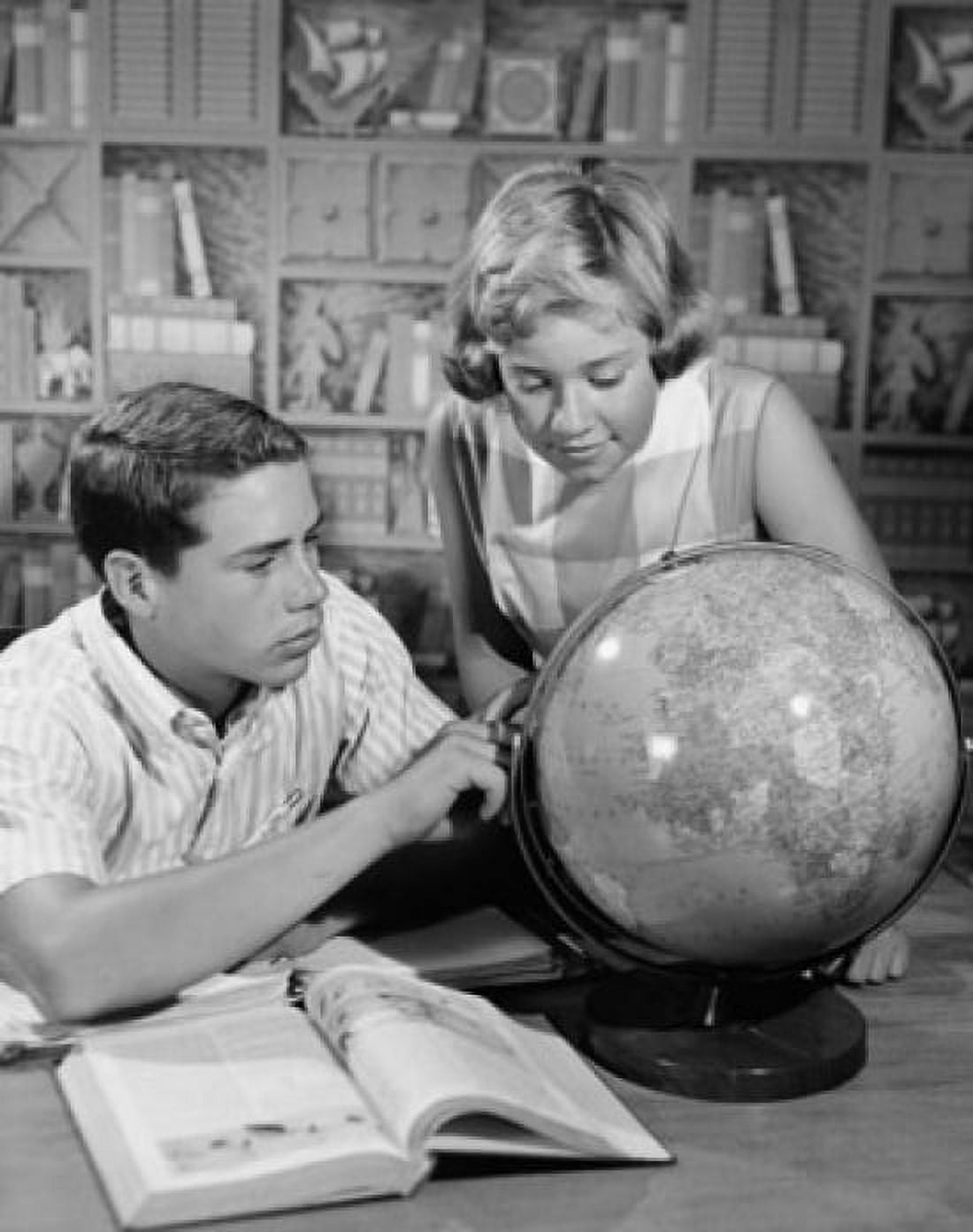 Posterazzi Teenage boy and his sister looking at a globe Canvas Art -  (24 x 36)