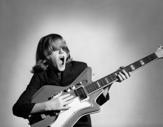 Posterazzi Teenage boy playing a guitar and singing Canvas Art - (24 x 36)