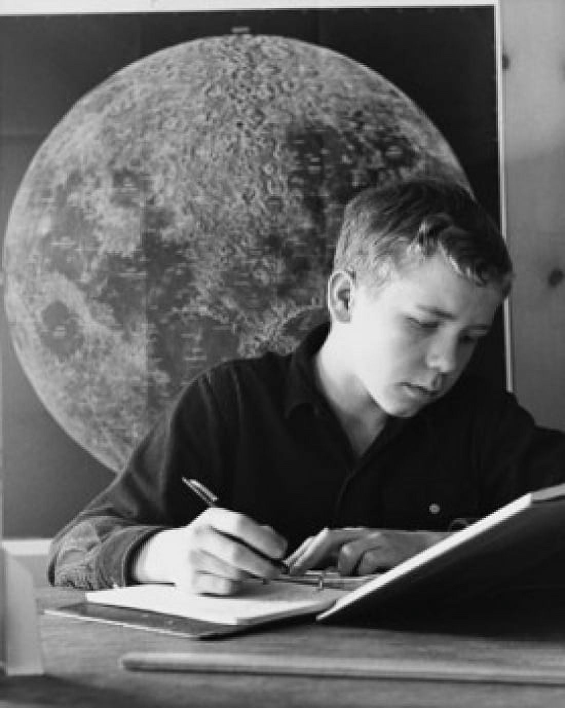 Posterazzi Teenage boy writing in a spiral notebook Canvas Art - (24 x 36)