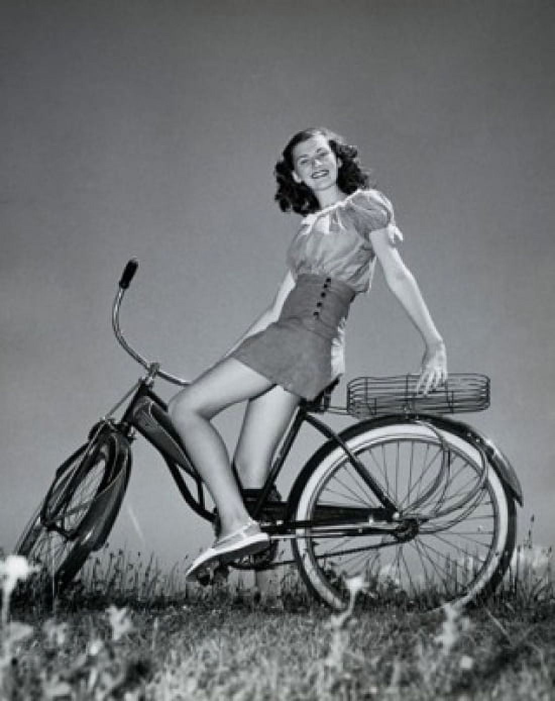 Posterazzi Teenage girl sitting on a bicycle and smiling Canvas Art - (24 x 36)
