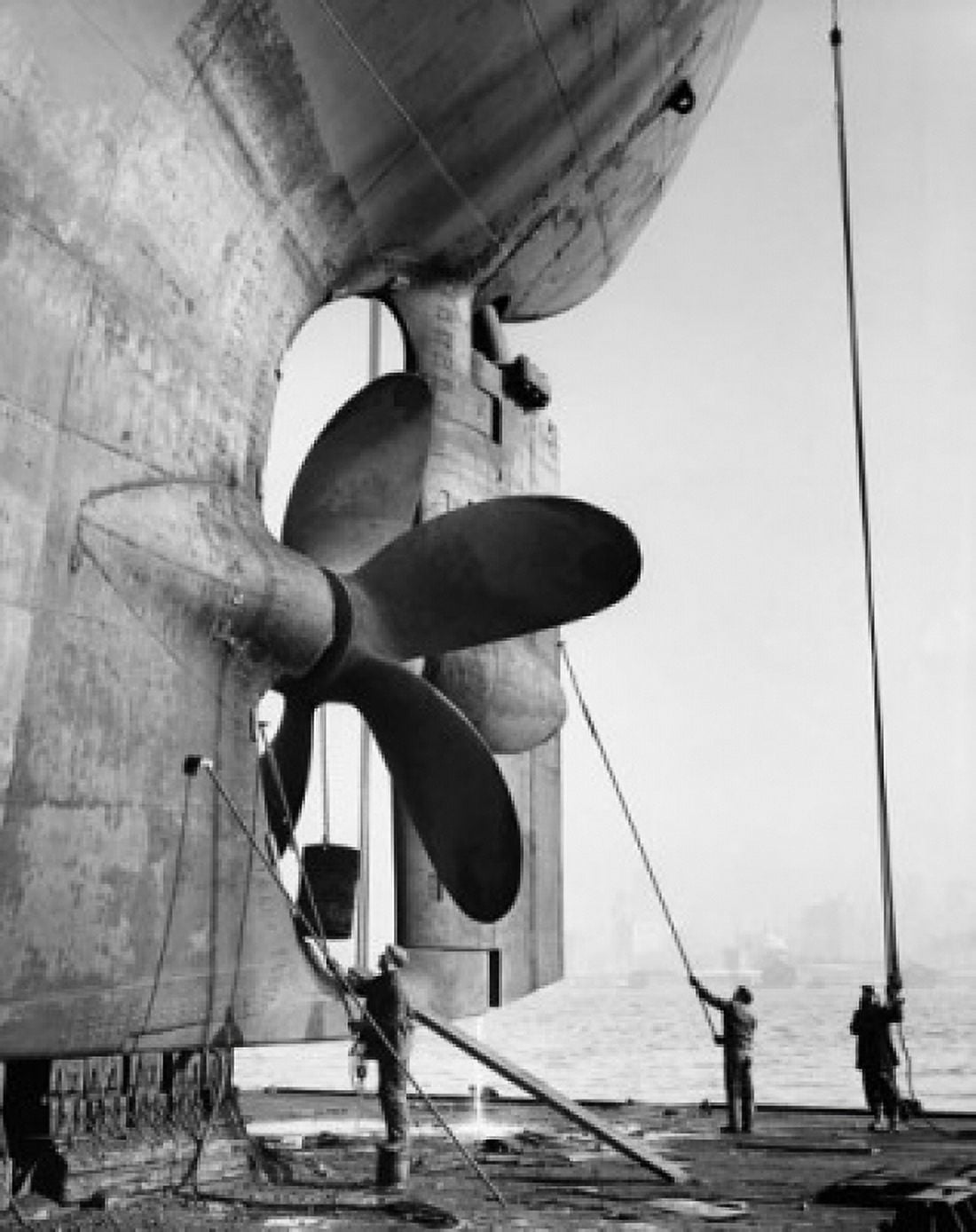 Posterazzi Three dock workers cleaning an industrial ship on a dry dock Todd Shipyards Corporation Hoboken New Jersey USA Canvas Art - (24 x 36)