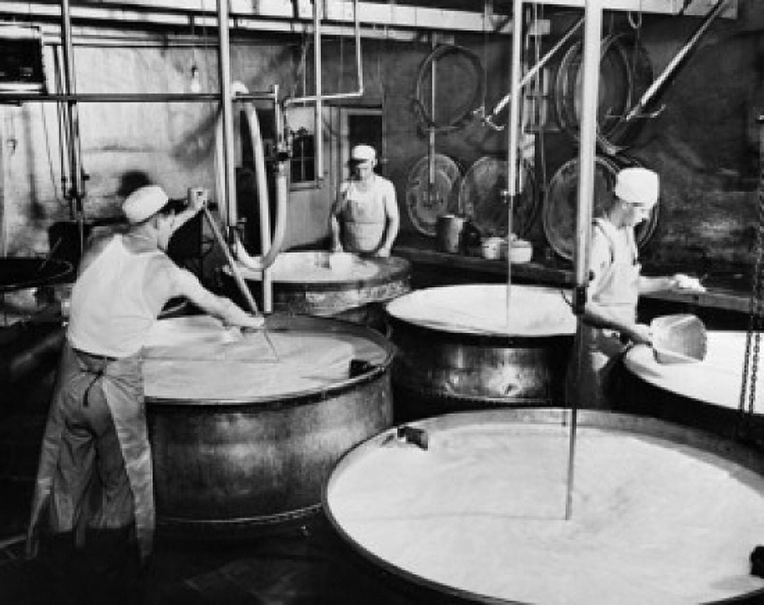 Posterazzi Three manual workers making cheese in a dairy factory Canvas Art -  (24 x 36)