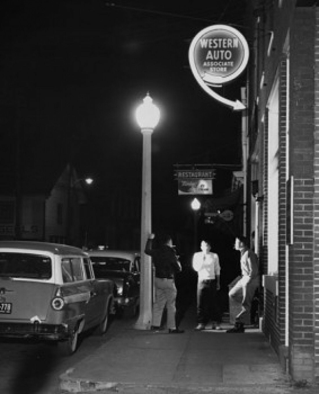 Posterazzi Three teenage boys standing on the sidewalk near a lamppost Canvas Art - (24 x 36)
