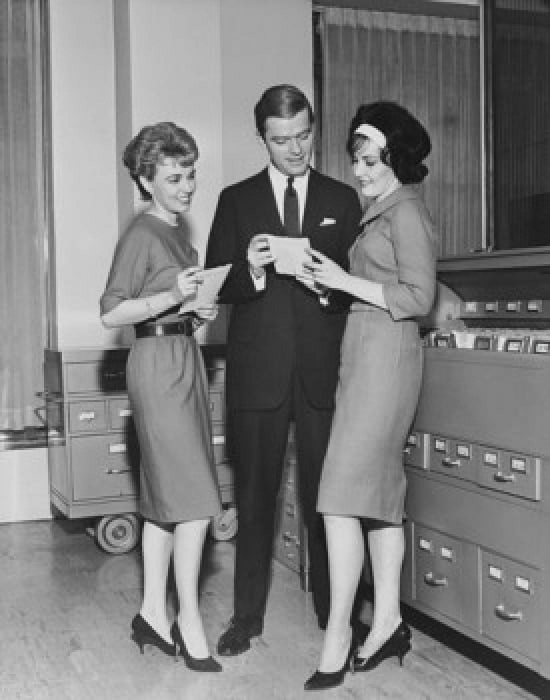 Posterazzi Two businesswomen and a businessman reading documents and smiling Canvas Art - (24 x 36)