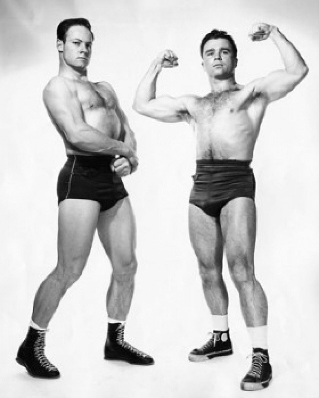 Posterazzi Two male body builders flexing their muscles Canvas Art - (24 x 36)