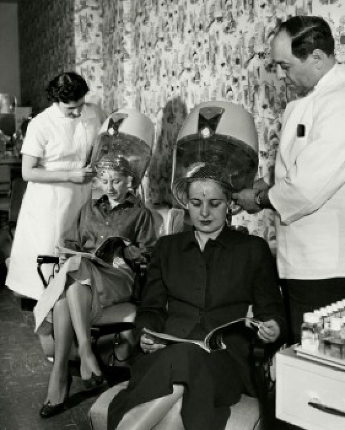 Posterazzi Two mid adult women sitting under dryers in hair salon Canvas Art - (24 x 36)