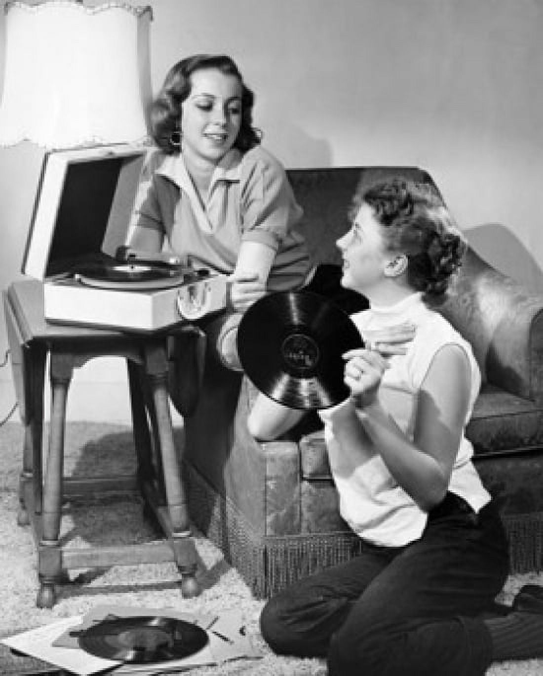 Posterazzi Two teenage girls listening to music Canvas Art - (24 x 36)
