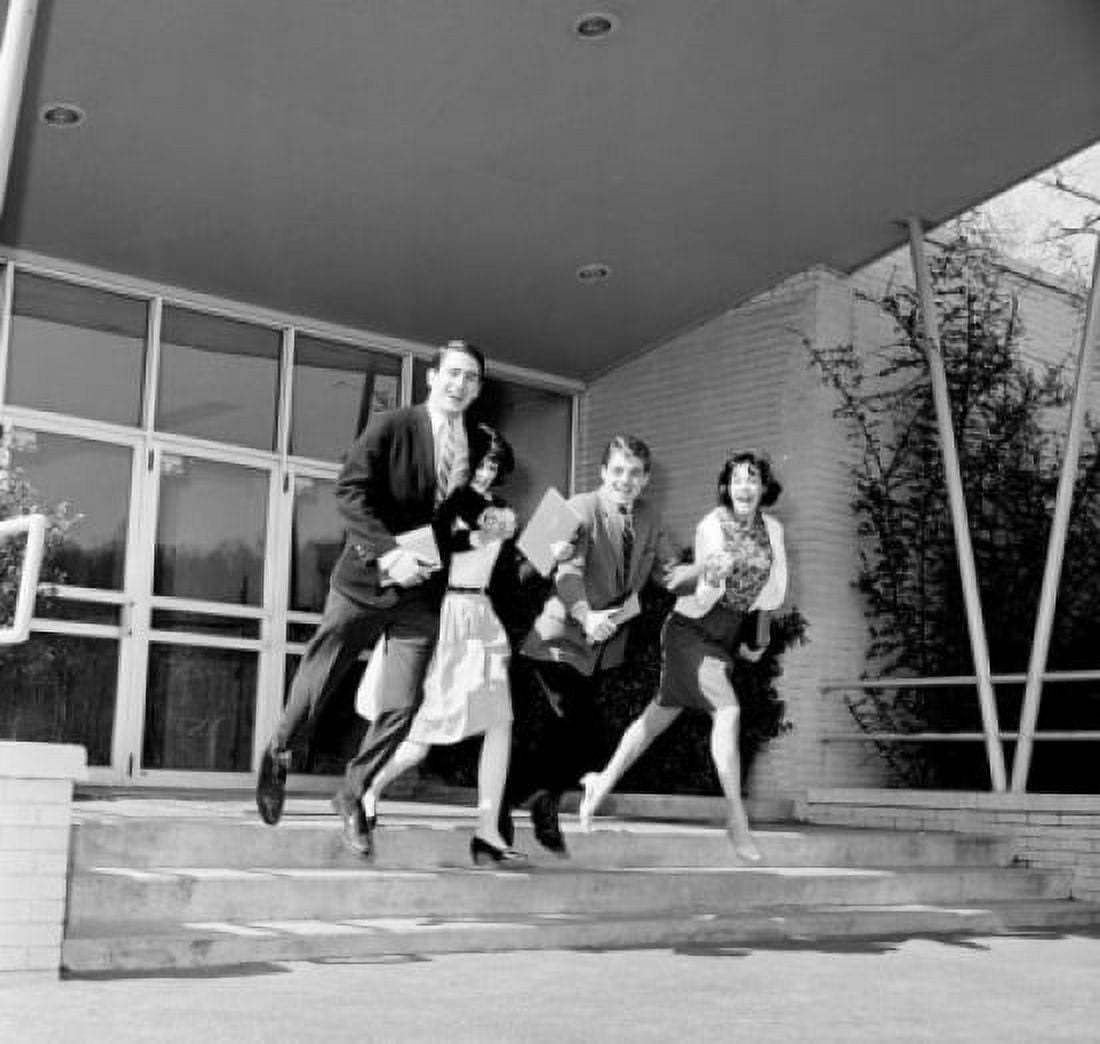Posterazzi Two young men and two young women running out of a university building Canvas Art -  (24 x 36)
