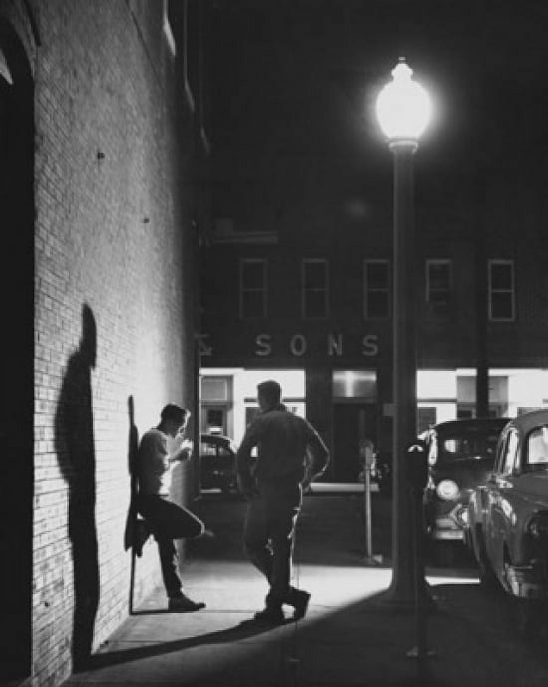 Posterazzi Two young men standing near a lamppost Canvas Art - (24 x 36)