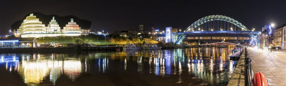 Posterazzi Tyne Bridge illuminated at nighttime over River Tyne and illuminated buildings Newcastle Tyne and Wear England Canvas Art - John Short Design Pics (36 x 11)