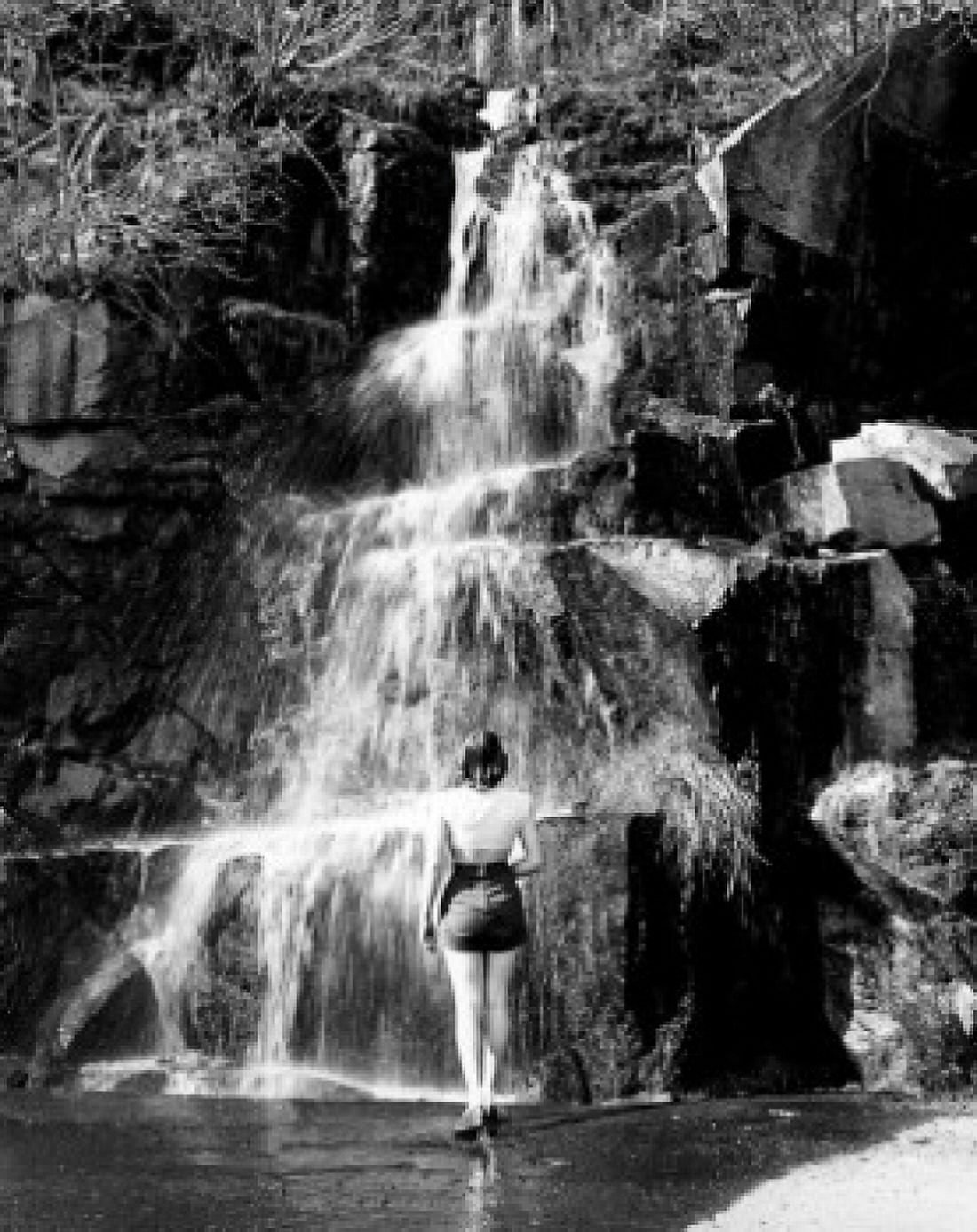Posterazzi USA Washington State Olympic National Park woman standing near waterfall Canvas Art - (24 x 36)