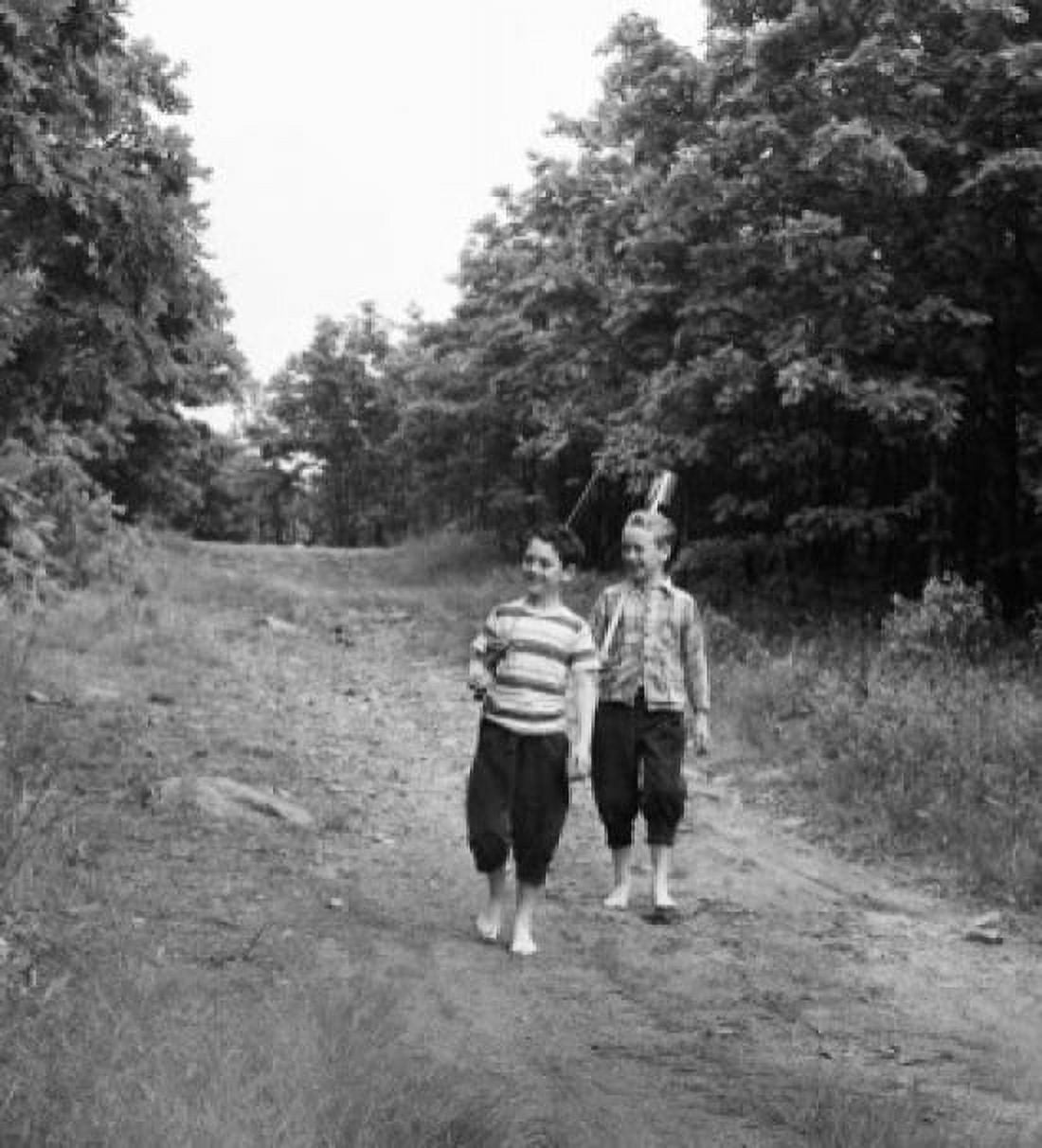 Posterazzi Vintage photograph of boys on forest footpath Canvas Art - (24 x 36)