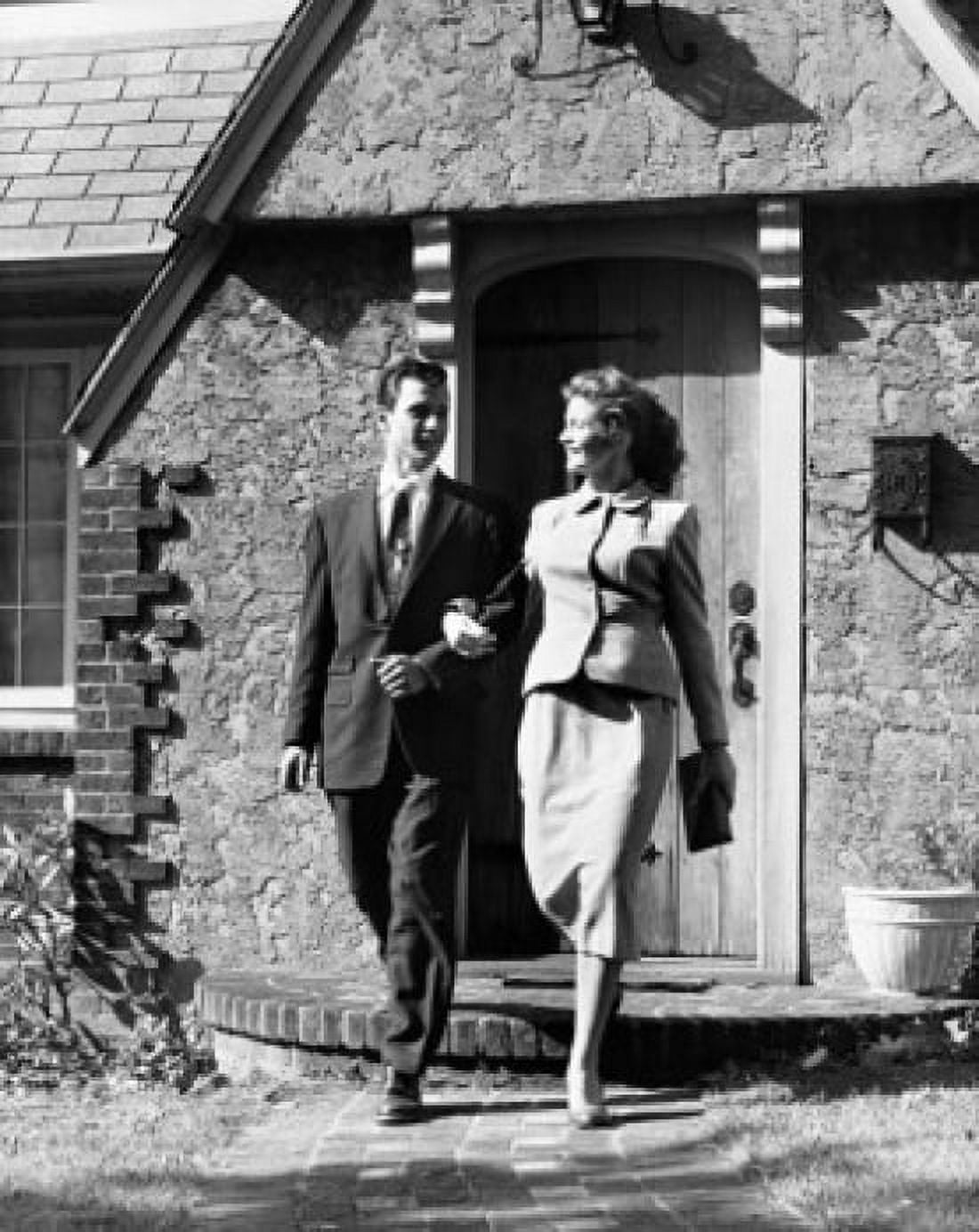 Posterazzi Young couple stepping out from their house Canvas Art - (24 x 36)
