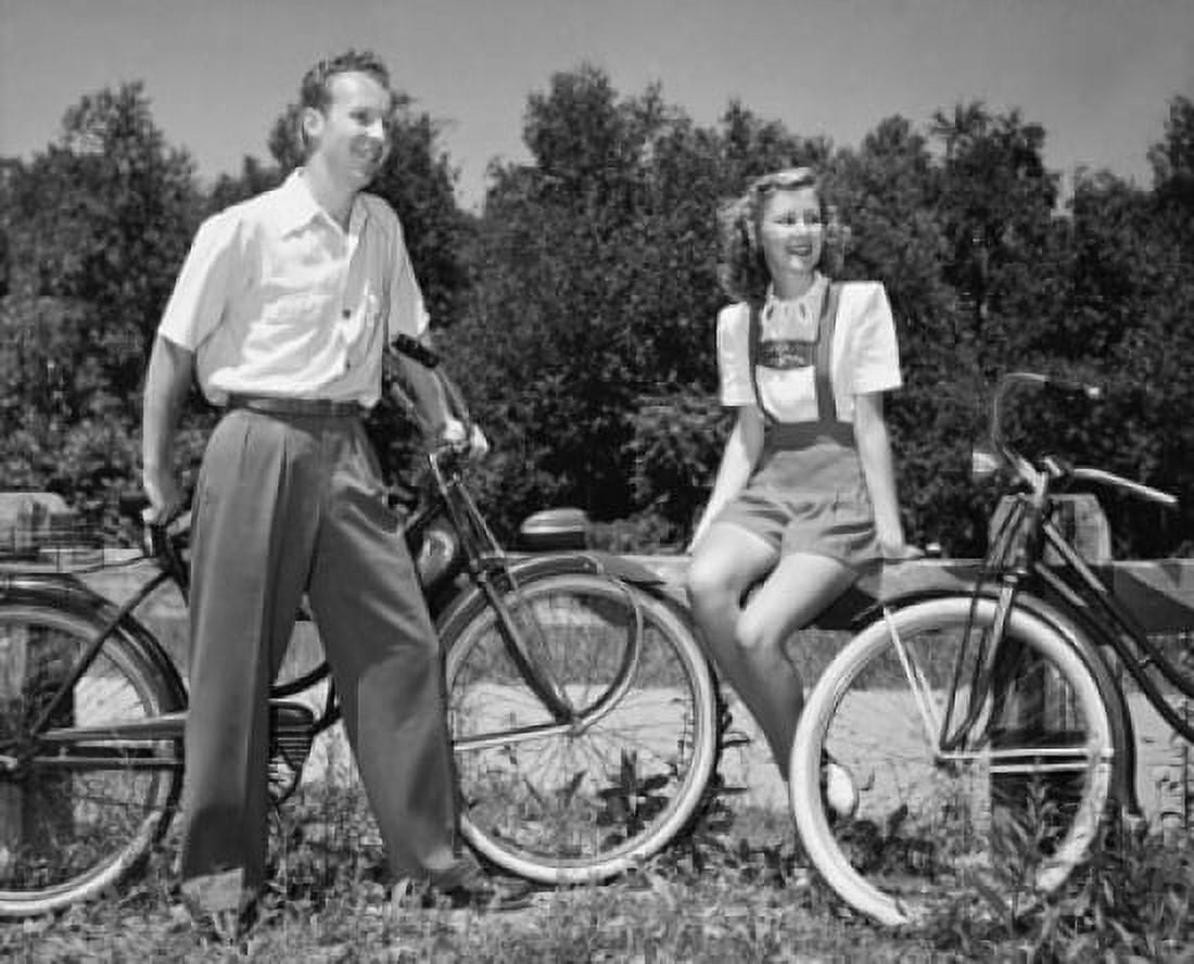 Posterazzi Young couple with bicycles in park Canvas Art - (24 x 36)