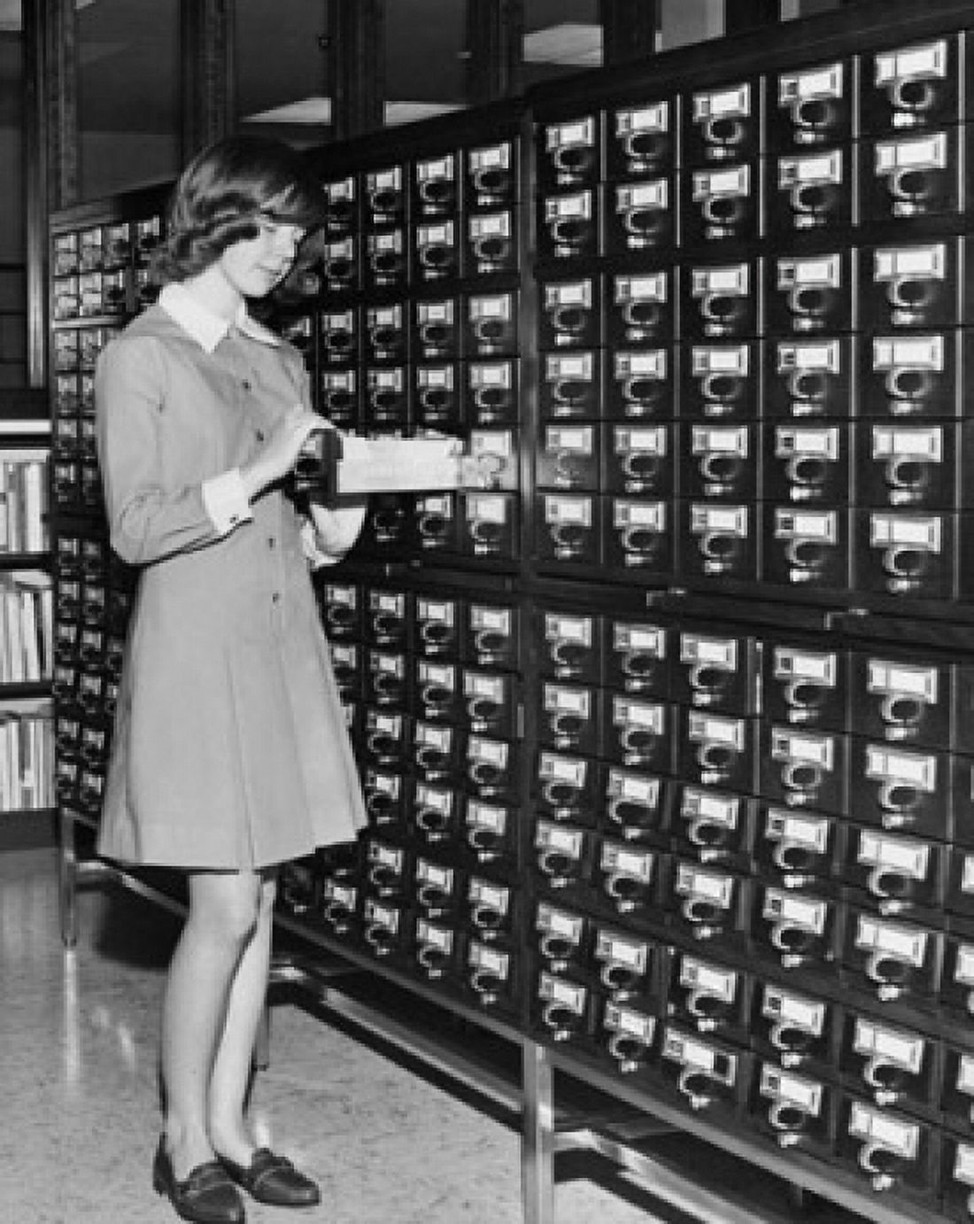 Posterazzi Young girl using the Library Card Catalog Canvas Art -  (24 x 36)
