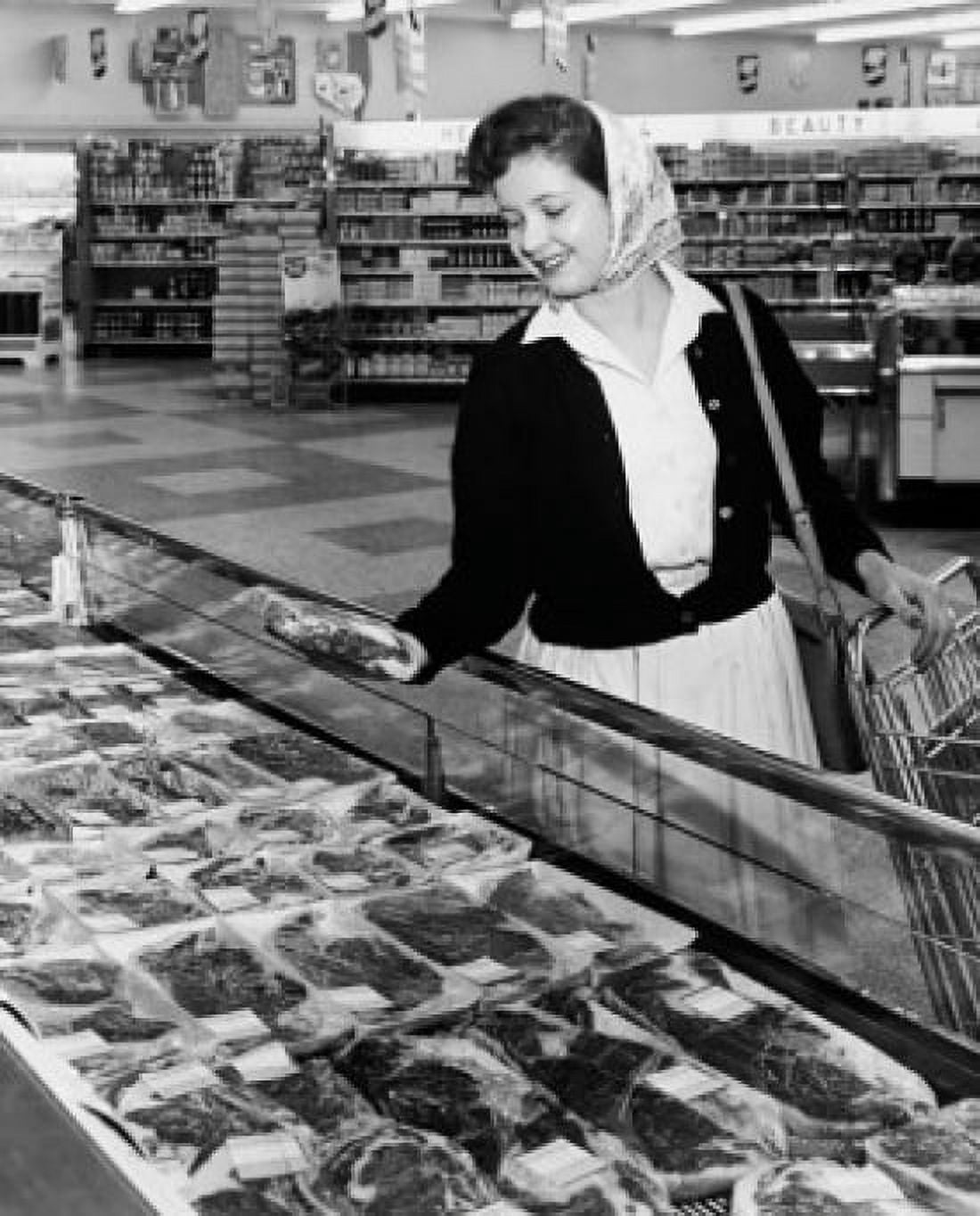 Posterazzi Young woman shopping in the meat case Canvas Art - (24 x 36)