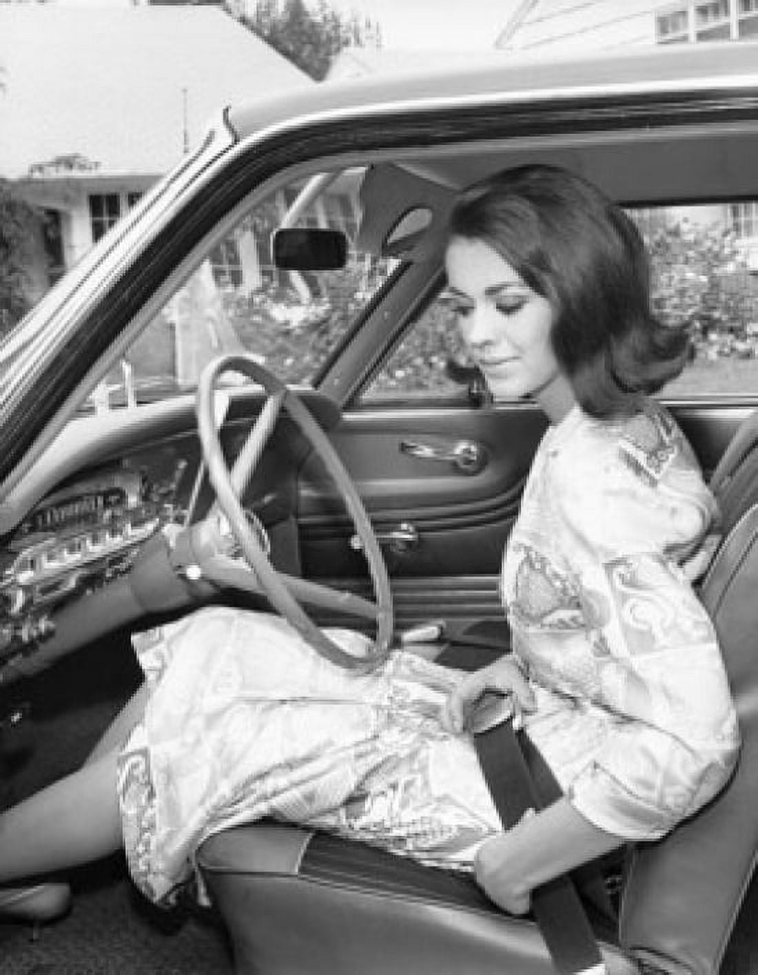 Posterazzi Young woman sitting in a car Canvas Art -  (24 x 36)