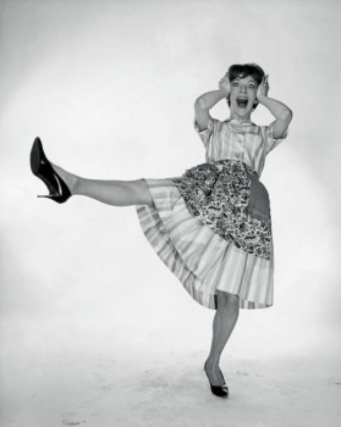 Posterazzi Young woman standing on one leg with her head in her hands Canvas Art - (24 x 36)