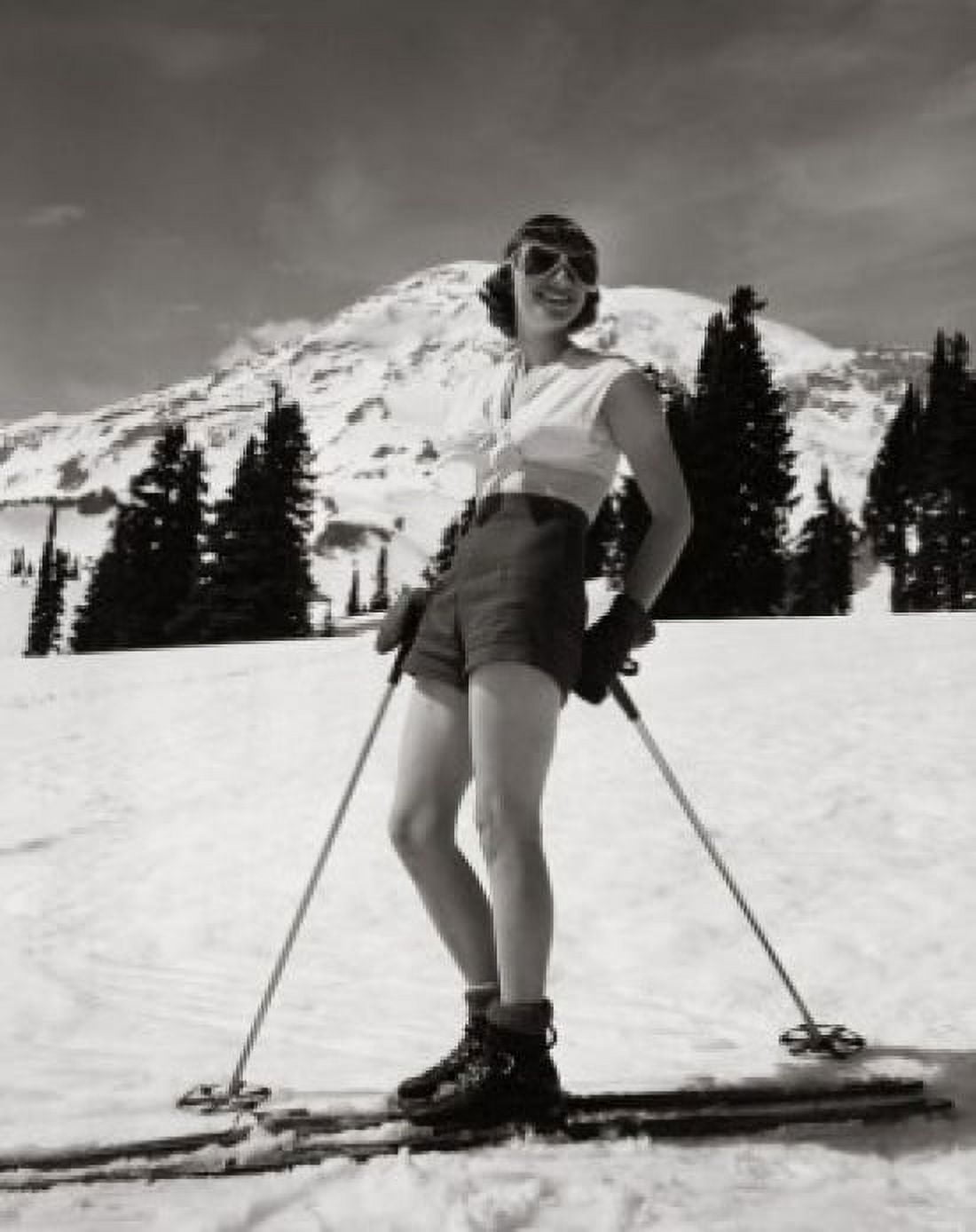 Posterazzi Young woman standing with skiing equipment and smiling Canvas Art - (24 x 36)