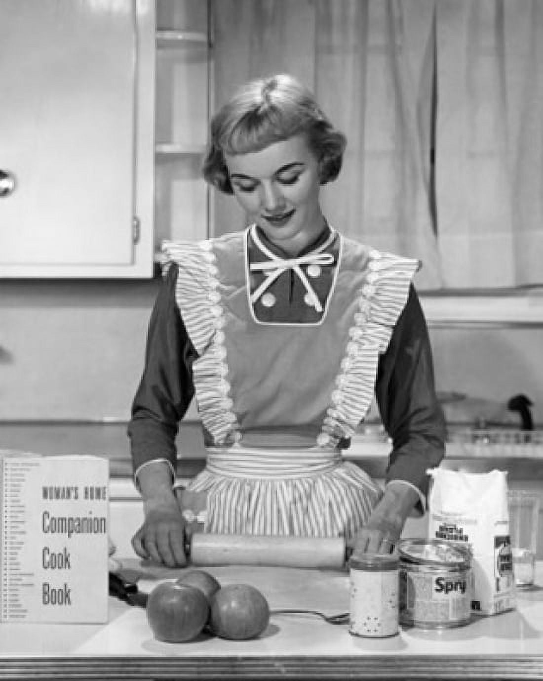 Posterazzi Young woman using a rolling pin in a domestic kitchen Canvas Art - (24 x 36)