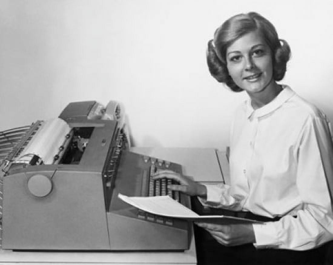 Posterazzi Young woman using a typewriter Canvas Art -  (24 x 36)
