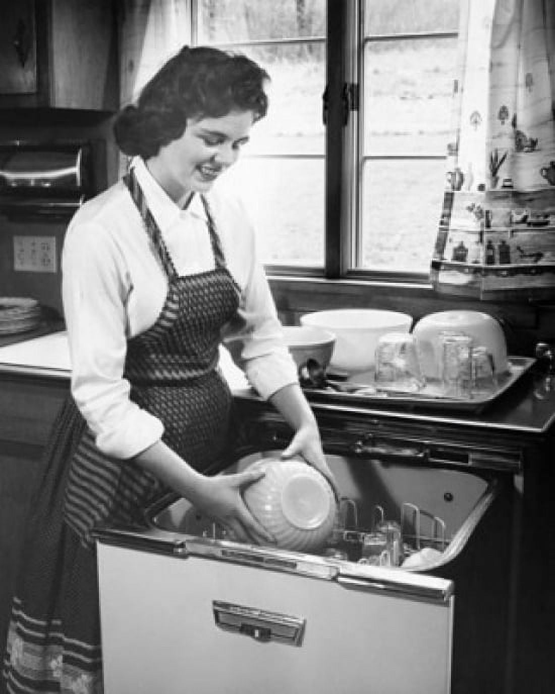 Posterazzi Young woman working in a kitchen Canvas Art - (24 x 36)