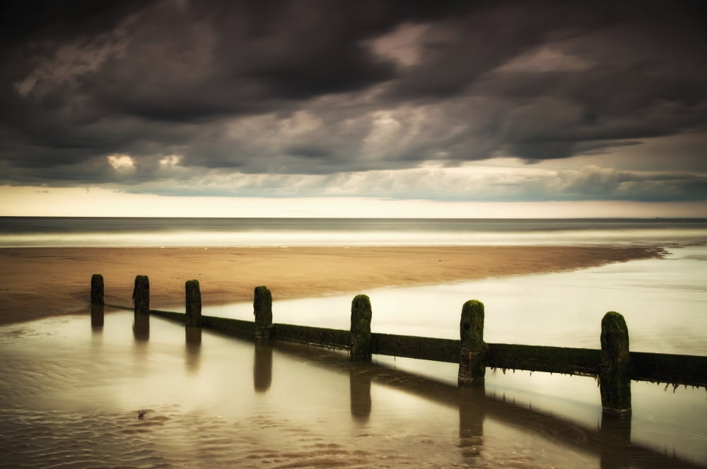 Posterazzi A fence submerged in the water at the coast with storm clouds overheadBerwick northumberland england Canvas Art - John Short Design Pics (38 x 24)