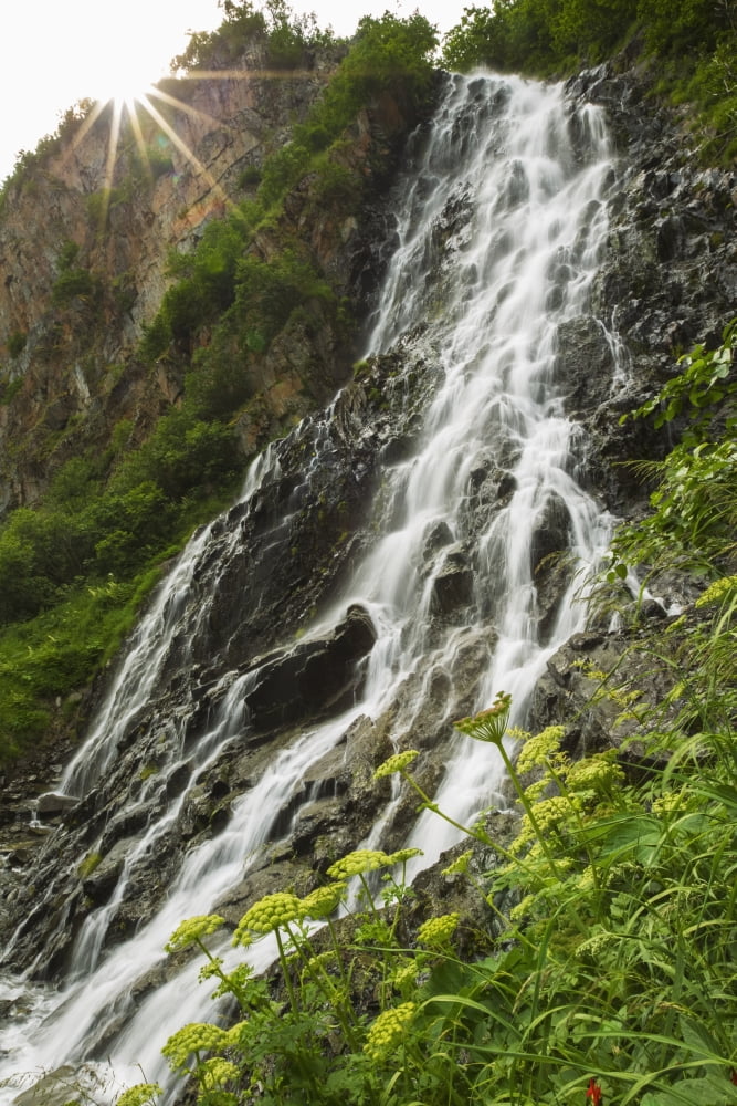 Posterazzi The sun begins to disappear behind Horsetail Falls Valdez Alaska United States of America Canvas Art - Zachary Sheldon Design Pics (24 x 38)