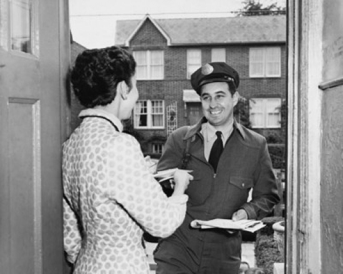 Postman delivering mail to a mid adult woman Canvas Art - (18 x 24)