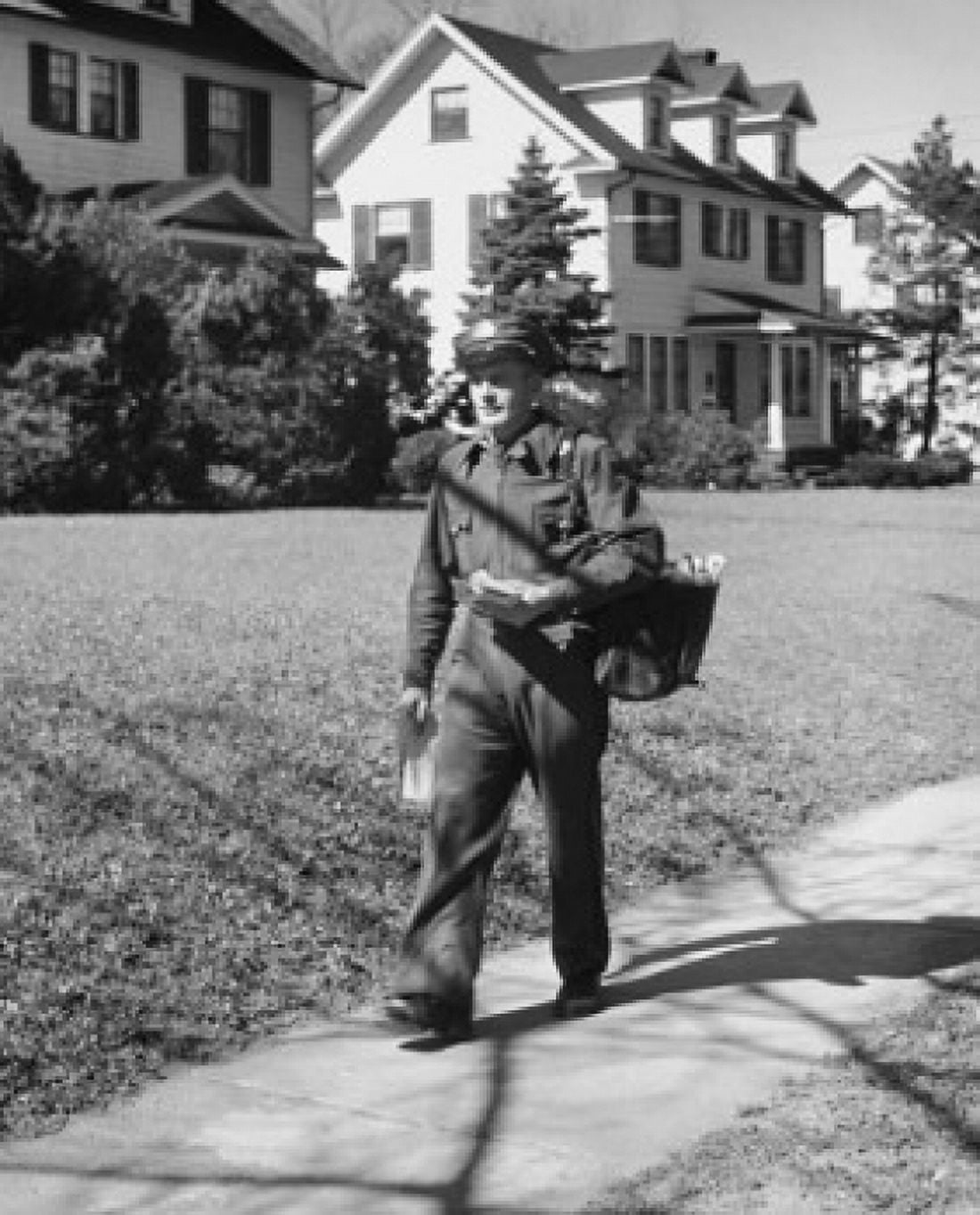 Postman walking with his mail bag Canvas Art - (18 x 24)