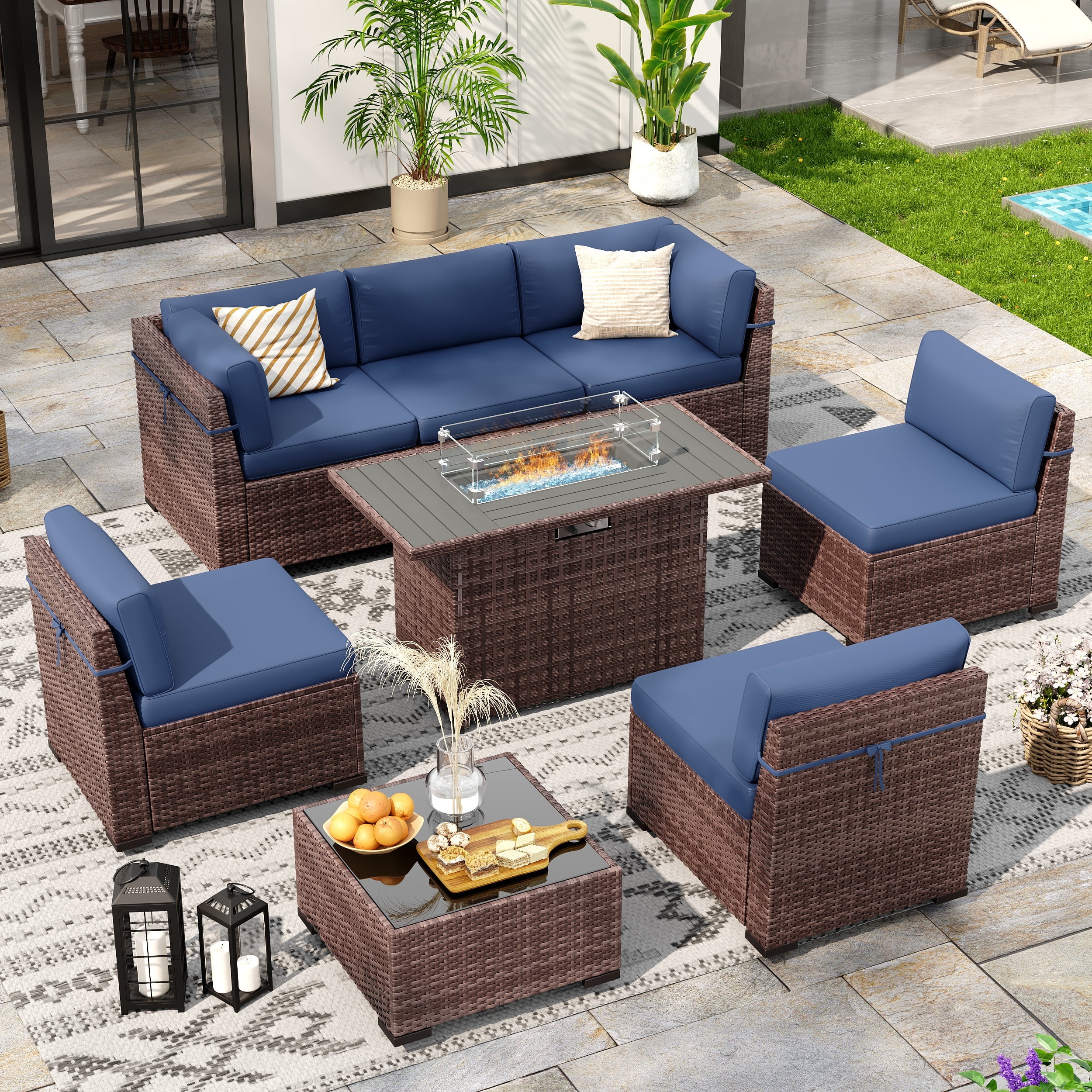 Poteban 8 Pieces Outdoor Patio Furniture Set with 44" Fire Pit Table, Brown Wicker Rattan Sectional Sofa with Cushions and Glass Coffee Table for Backyard Garden, Navy Blue