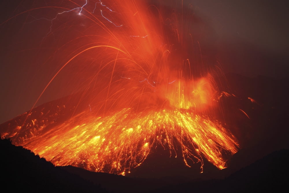 Powerful night time explosive eruption of Sakurajima volcano Japan Canvas Art - Richard RoscoeStocktrek Images (35 x 23)