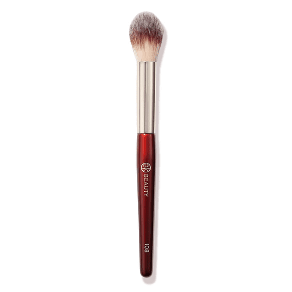 Pozyie BK Brush 108 Precision Powder Brush - Professionally designed conical brush, used for precise under-eye application, with smooth surface and subtle highlights.