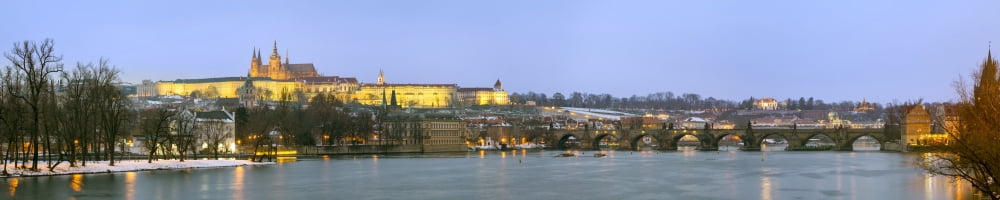 Prague Castle (Prahran) and Charles Bridge (Karluv most) seen from the banks of the River Vltava at Night Prague Bohemia Czech Republic Canvas Art - Panoramic Images (36 x 12)