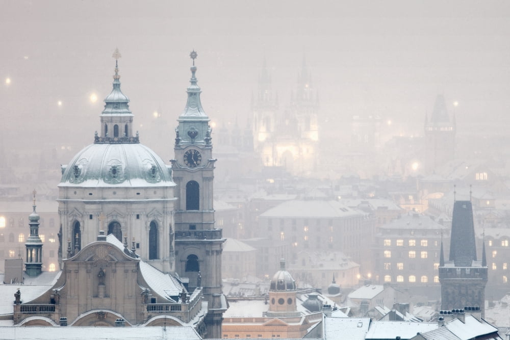 Prague - St Nicholas church and spires of the Old Town during snowfall Canvas Art - Panoramic Images (27 x 9)