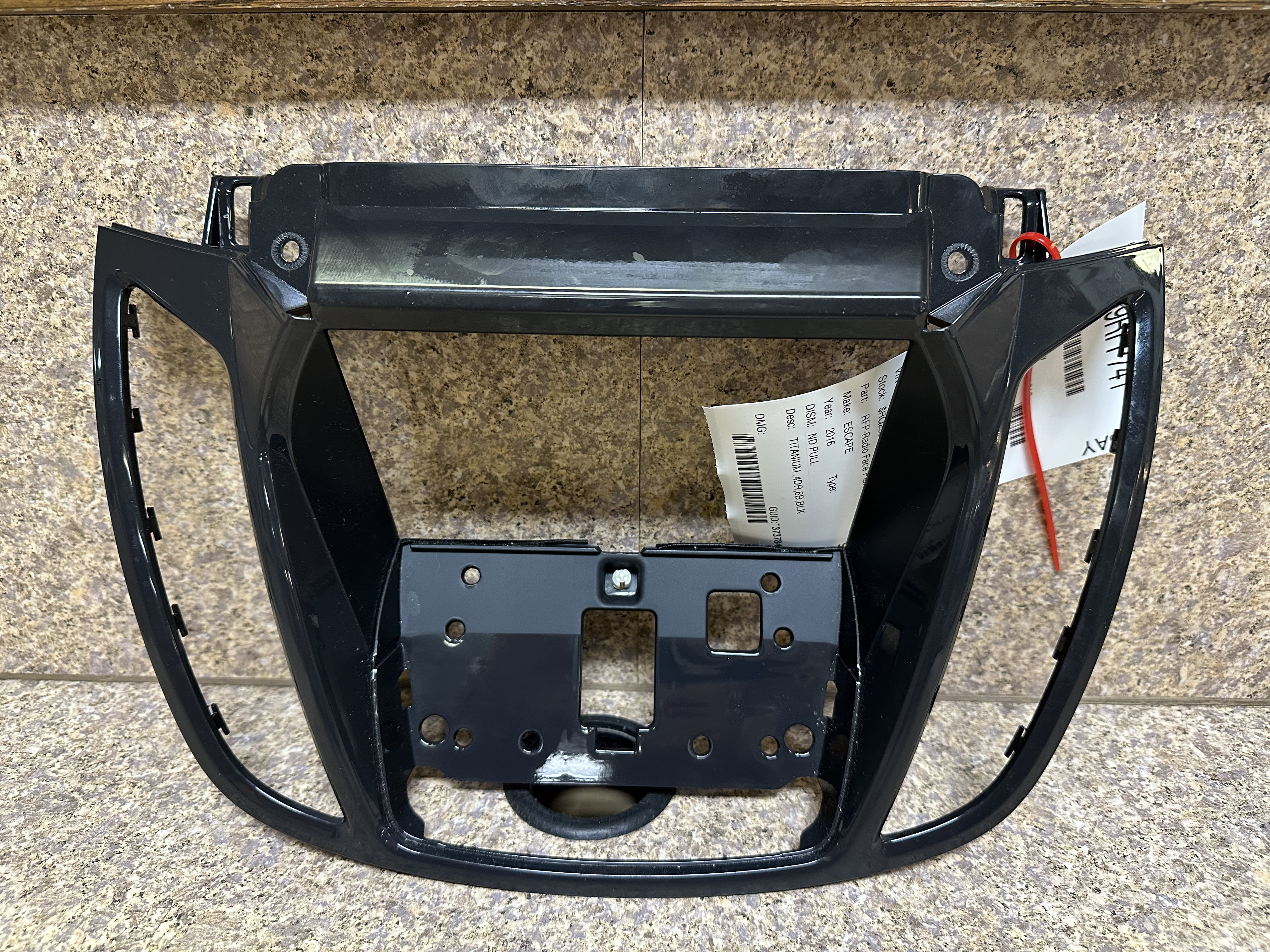 Pre-Owned 16 Ford Escape Radio Bezel OEM LKQ - Verify Specific Vehicle Fitment In Description - (Good)