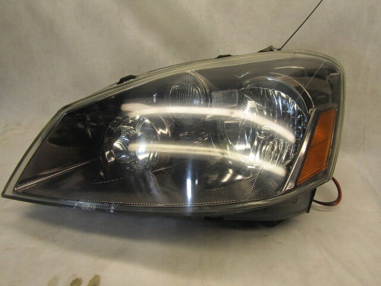 Pre-Owned Aftermarket LH Driver Head Lamp For a 2005 2006 Nissan Altima LKQ (Good)
