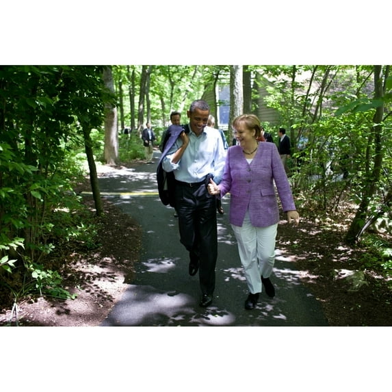 President Barack Obama Talks With Chancellor Angela Merkel Of Germany During The G8 Summit. They Are Walking On A Path