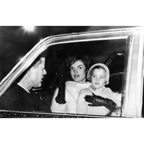 President John And Jacqueline Kennedy In A Limousine With Their Four Year Old Daughter Caroline. They Were Riding From Otis Air Force Base To Their Home At Hyannis Port To Celebrate Thanksgiving With