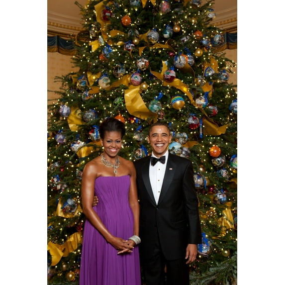 President And Michelle Obama Pose In Front Of The Official White House Christmas Tree Dec. 6 2009. Michelle Wears A Purple Pleated Chiffon Dress With A Corset Lacing Back By Peter Soronen With Tom