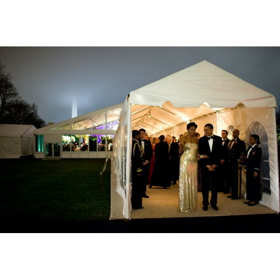 President And Michelle Obama Wait For Indian Prime Minister Singh S Motorcade To Depart At The Conclusion Of The First Official State Dinner For The Obama Administration. Michelle'S Dress Is By Indian