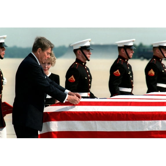 President Reagan Attaches A Medal To A Flag-Draped Coffin Of One Of Four Marines Killed In The Zona Rosa Terrorist