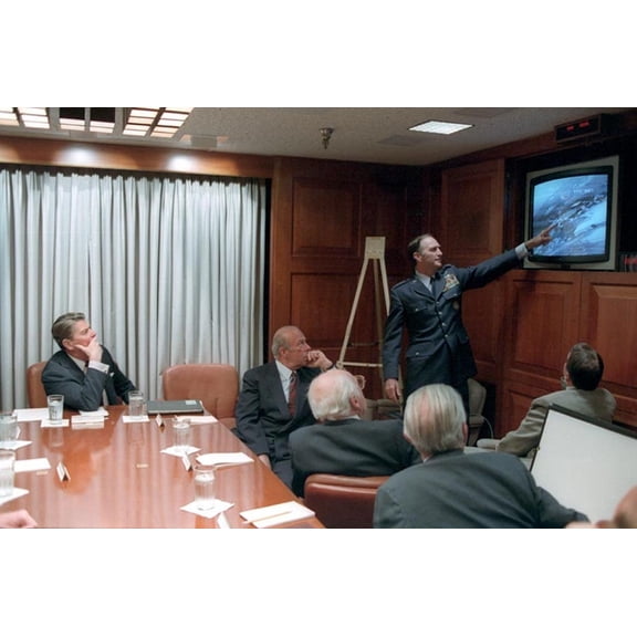 President Reagan Being Briefed By The National Security Council On The Libya Air Strike. The Strike Attacked Military Targets And The Residence Of Libyan Leader Muammar Gaddafi. L To R President