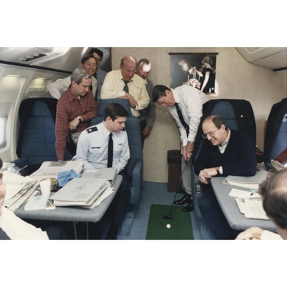 President Reagan Putting A Golf Ball Around Air Force One While Flying To Geneva Summit With Soviet Union'S Gorbachev. Standing To Reagan'S Right Are George Shultz And Don Regan. November 16 1985.