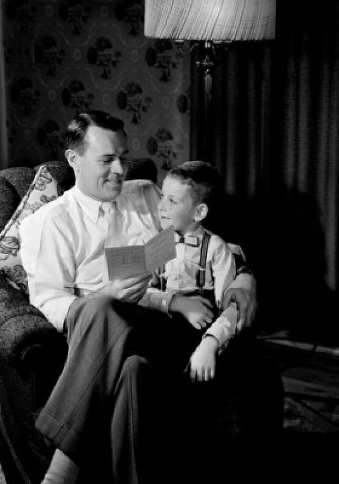 Pride father sitting with son and holding report card Canvas Art - (18 x 24)