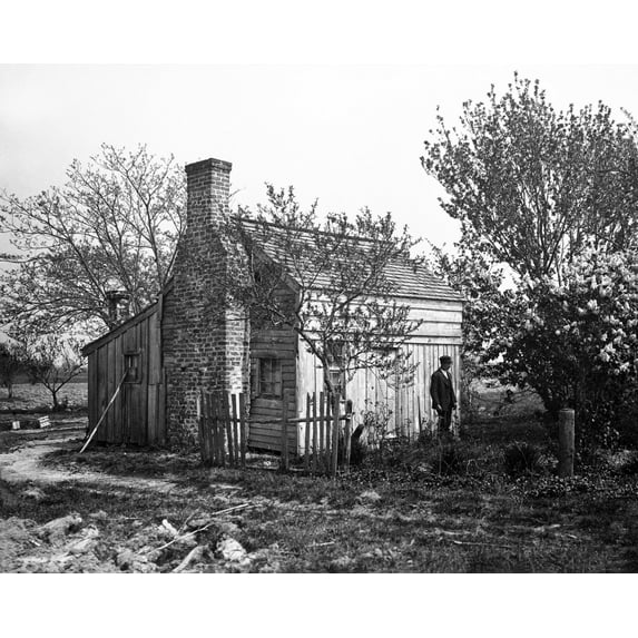 Print: African American Man In Front Of Small House, 1901