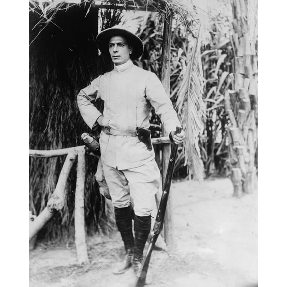 Print: Between Savage And Tiger. Man In Khaki Hunting Costume With Gun In