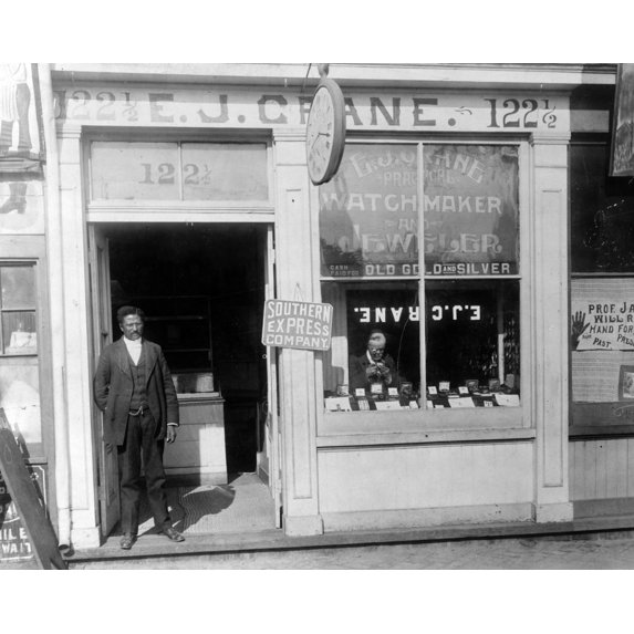 Print: E.J. Crane, Watchmaker And Jewelry Store With Man Working In Window